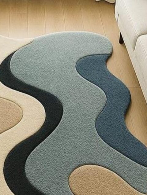 Modern abstract handmade tufted wool rug with organic wave design