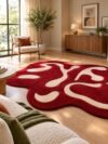 Crimson flow abstract rug with cream flowing lines in a sunlit living room
