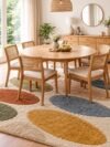 Dining table tufted rug with mustard, olive and terracotta petals under a round table