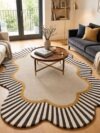 Scalloped sunburst rug in cream, charcoal and mustard under a round coffee table